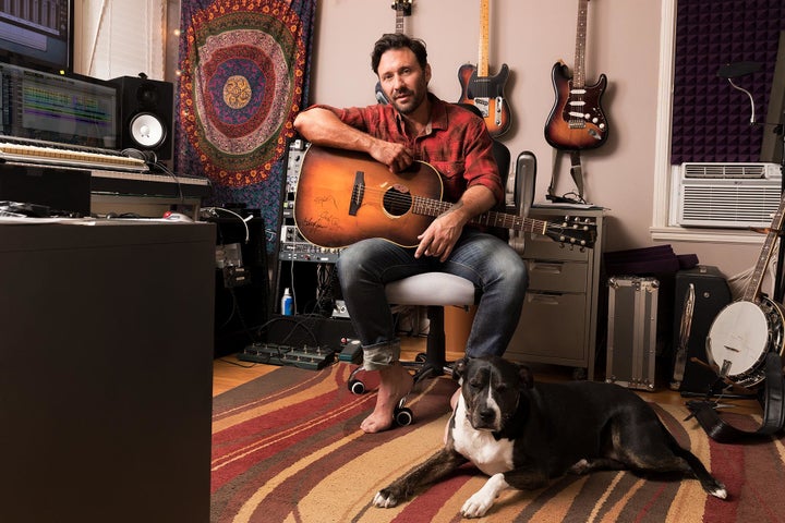 Travis Howard, Award-Winning Country Music songwriter, performer, and now documentary filmmaker photographed in his home studio. 