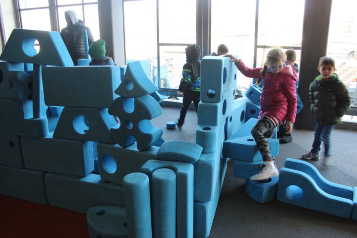 BASIS elementary students play with blocks in a half-indoor, half-outdoor recreation room. BASIS gives its K-3 kids three 15-minute periods of playtime throughout the day, in addition to lunch, physical education, and a morning snack.