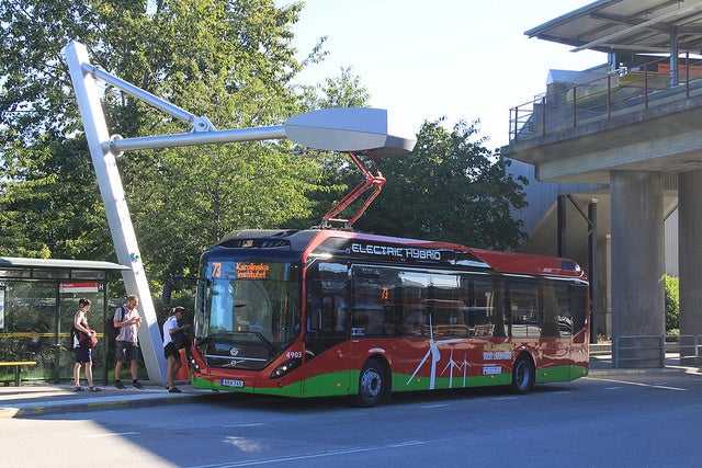 <p>New hybrid-electric city bus at a Stockholm charging station. Buses charge within 6 minutes and can travel up to 7 kilometers on a charge. </p>