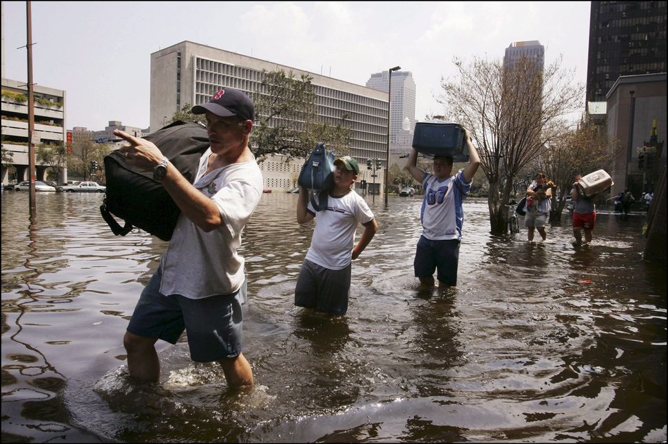 Survivors of Hurricane Katrina evacuate their homes on Sept. 3, 2005.