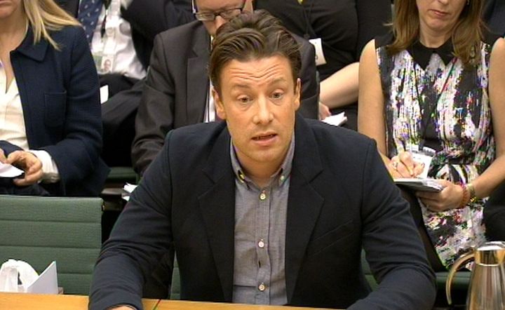 Jamie Oliver has branded Theresa May's plans to scrap free school meals for infants a 'disgrace' 