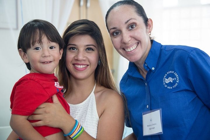 Fredyla Urena, RN, from VNSNY’s Nurse-Family Partnership with a first-time mom and her son in Nassau County, NY.