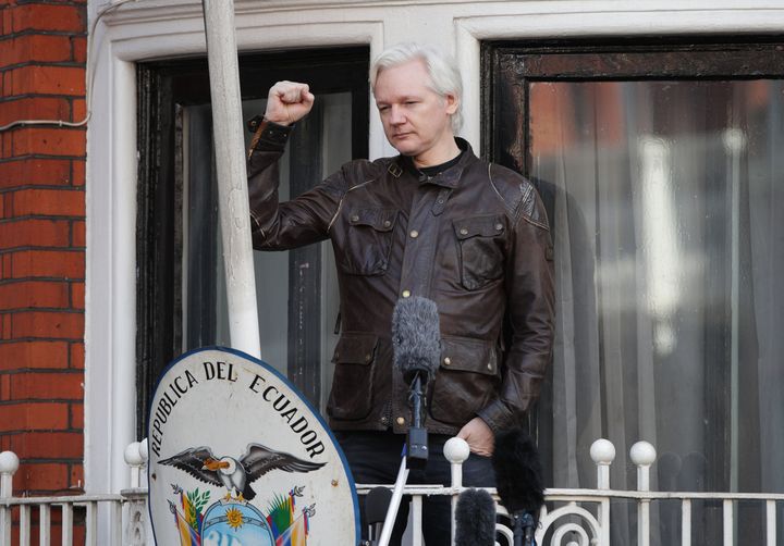 Julian Assange appears outside the embassy after Sweden dropped its case against him