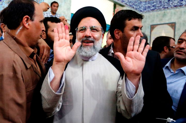 Iranian presidential candidate Ebrahim Raisi gestures after casting his ballot for the presidential elections at a polling station in southern Tehran on May 19, 2017.