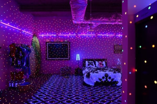 Yayoi Kusama (b. 1929); I’m Here But Nothing; 2000/2017; vinyl stickers, UV lights, furniture, household objects, dimensions