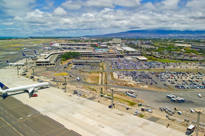 A man was arrested on Friday at a Honolulu airport (pictured above)m after causing a disturbance during an American Airlines flight bound for Hawaii.