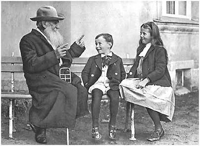 Tolstoy telling a story to his grandchildren