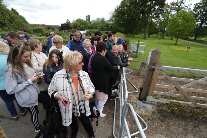 Members of the public arrive ahead of the wedding of the Duchess of Cambridge's sister at St Mark's church in Englefield, Berkshire