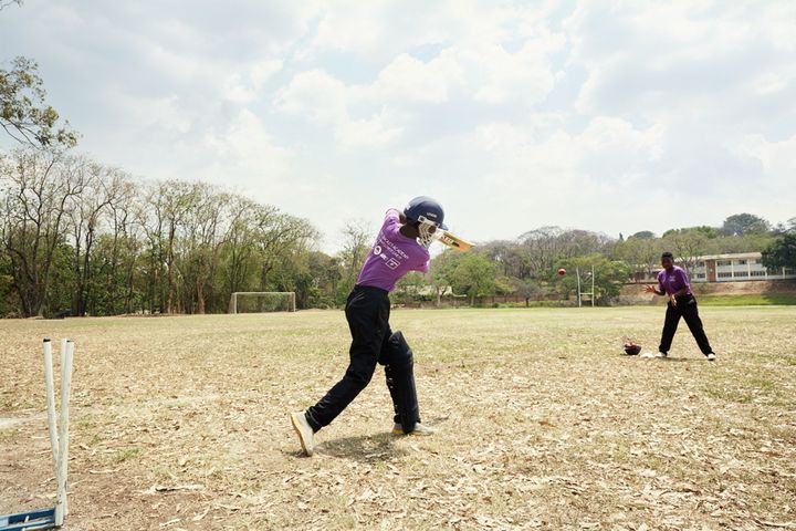 Shahida tries to catch a ball during fielding practice, Blantyre, Malawi, 2016.