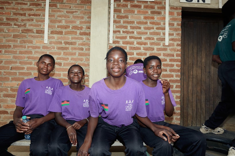 From left to right: Shalani, Triphonia, Chimwemwe, and Tadala wait to begin their cricket theory class, Malawian U19 Women’s