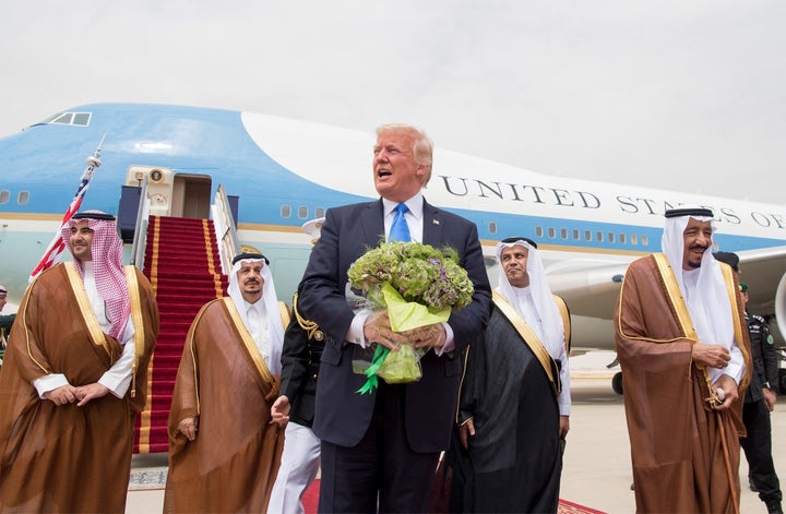 President Donald Trump is welcomed by Saudi Arabia's King Salman bin Abdulaziz Al Saud (R) during their arrival at the King K