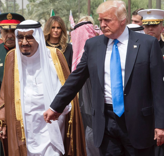 President Trump holding hands with King Salman of Saudi Arabia at the royal al-Yamamah Palace in Riyadh