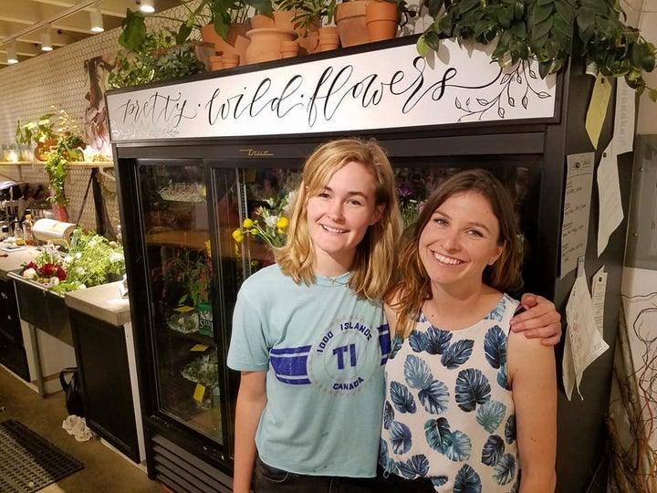 <p>Natalie Gill, owner of Native Poppy with a store manager</p>