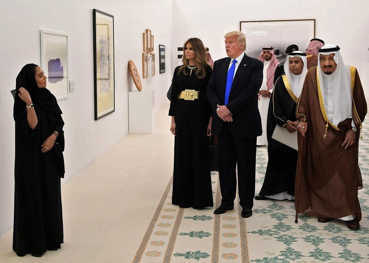 U.S. President Donald Trump, first lady Melania Trump and Saudi Arabia's King Salman bin Abdulaziz al-Saud, at right, look at Saudi modern art at the Saudi Royal Court in Riyadh.
