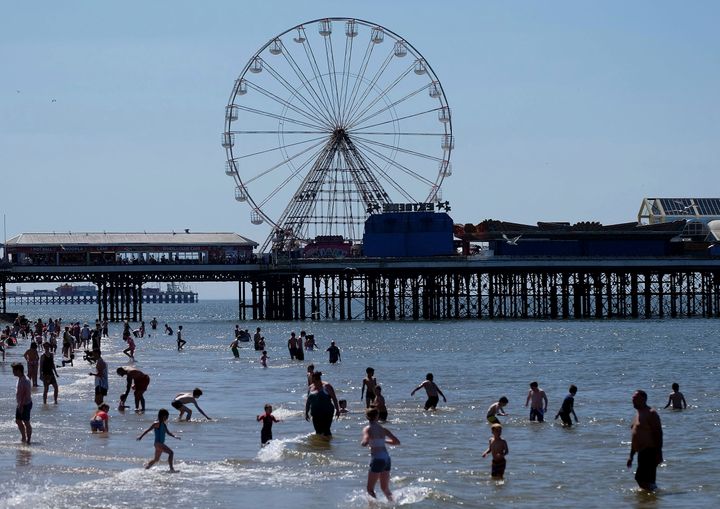 People enjoy the hot weather in Blackpool last year. Temperatures are set to soar this week