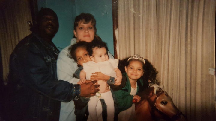 Jonathan and Brandi Meadows, with their three children. Bresha is the baby in the middle.