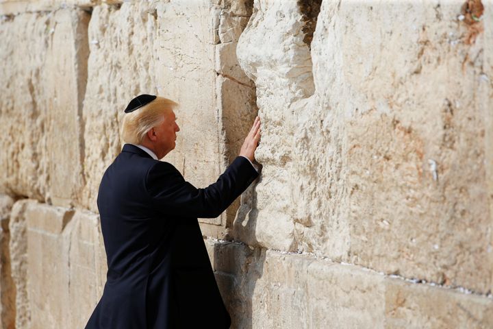 U.S. President Donald Trump touches the Western Wall, Judaism's holiest prayer site, in Jerusalem's Old City May 22, 2017.