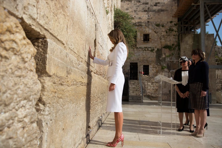 U.S. first lady Melania Trump prays as she touches the Western Wall, Judaism's holiest prayer site, in Jerusalem's Old City M