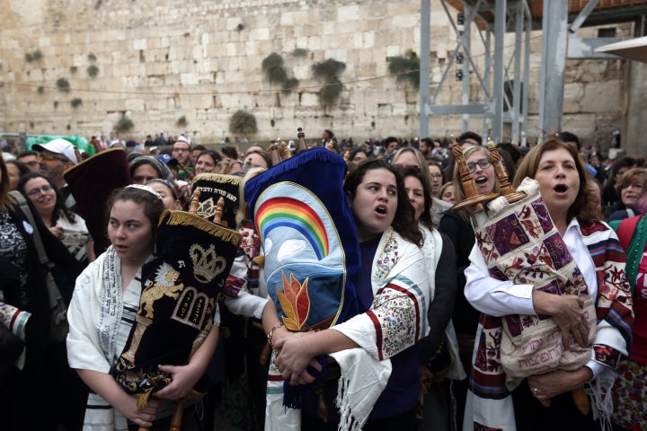 Israeli members of the liberal Jewish religious group Women of the Wall, carry a Torah scroll after prayers in the women's section of the Western Wall, in the Old city of Jerusalem on November 2, 2016, during a protest by the group demanding equal prayer rights at the site.