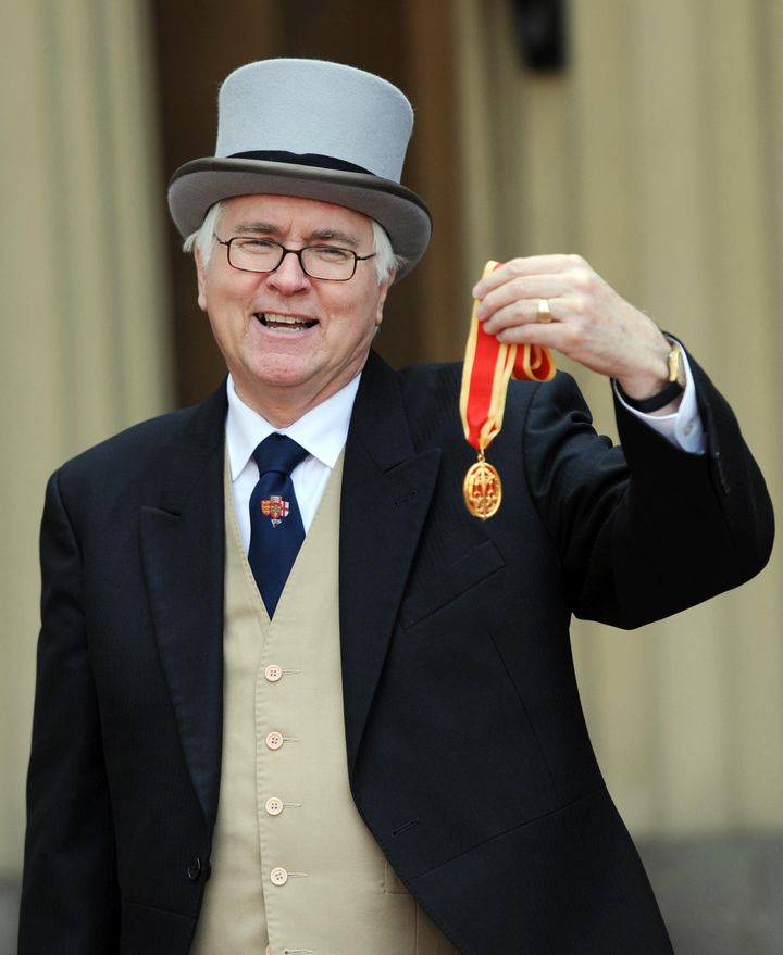 Sir Bob Russell collecting his knighthood.