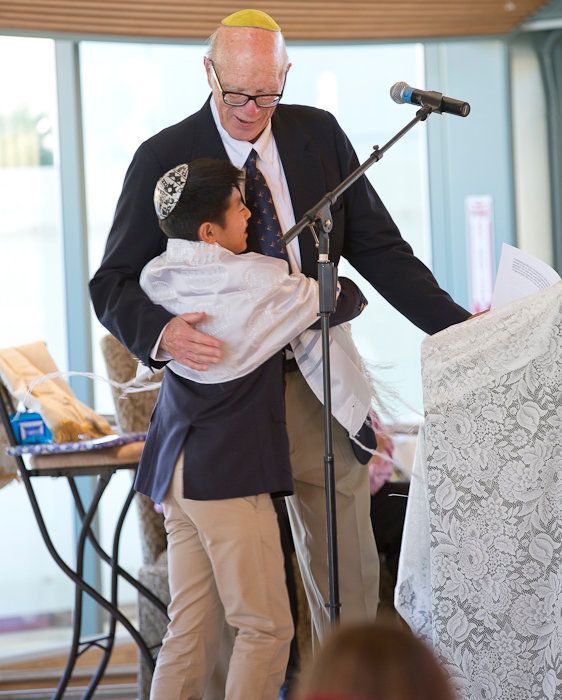 The author's late husband with their son becoming a Bar Mitzvah in 2014. He is missed in the smallest of ways, including as the homework kin.