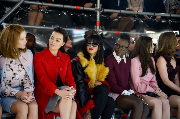 Rihanna and Lupita Nyong'o attend the Miu Miu show during Paris Fashion Week on March 5, 2014.