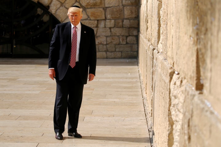 U.S. President Donald Trump stands after leaving a note at the Western Wall in Jerusalem May 22, 2017.