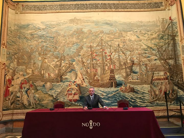 Robert Kennedy Jr. in front of a tapestry memorializing Charles V's Spanish conquest of Tunisia. May 2017