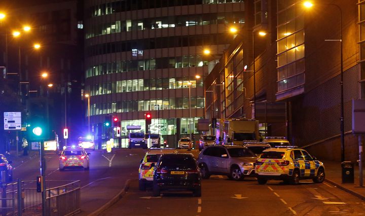 Police and emergency services vehicles at the scene outside the Manchester Arena where Ariana Grande had been performing