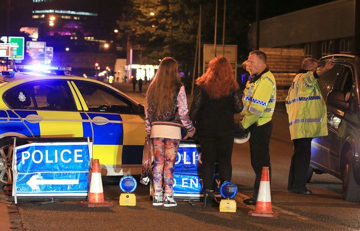 <strong>Police at the Manchester Arena, where US singer Ariana Grande had just finished performing before the explosion</strong>
