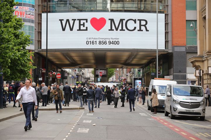 'We Love Manchester' signs have sprung up around the city