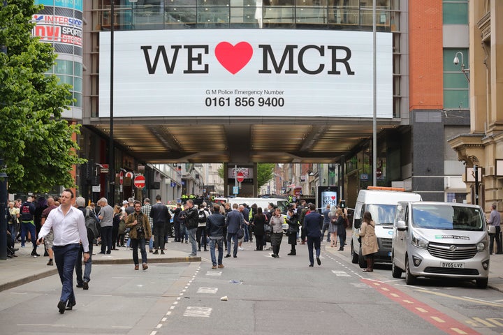 'We Love Manchester' signs have sprung up around the city