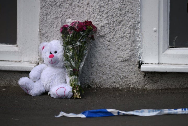 Tributes left near police tape at the scene