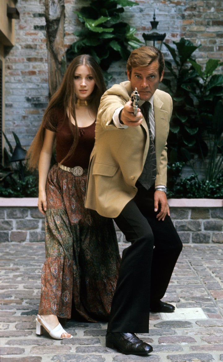 Jane Seymour and Roger Moore pose during the filming of "Live and Let Die," 1973.