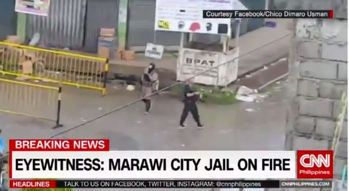 CNN carried a report saying Marawai City Jail was on fire and that a police patrol car had been used to display the IS flag