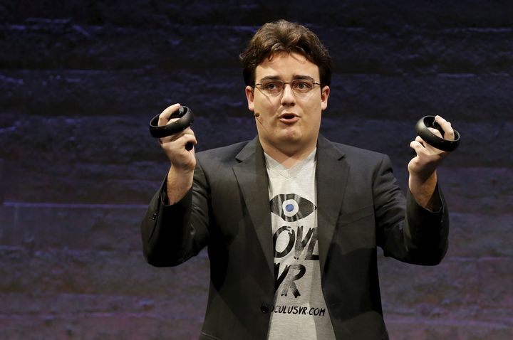 Oculus founder Palmer Luckey displays an Oculus Touch input during an event in San Francisco, June 11, 2015.