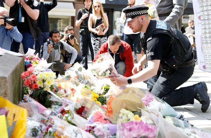 Flowers are being left in St Ann's Square in Manchester, the day after 22 people lost their lives in the suicide bombing 