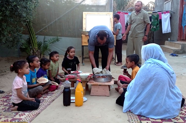 <p>A family sits down for iftar in Gaza</p>