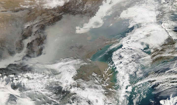  Heavy gray smog blankets northeastern China, including Beijing and Tianjin, on Dec. 18, 2016 during a five-day air pollution ‘red alert.’ (NASA Earth Observatory)