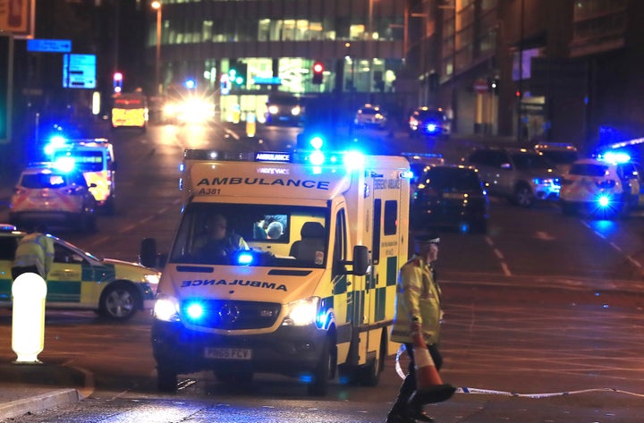 Emergency services at Manchester Arena after reports of an explosion at the venue during an Ariana Grande gig.