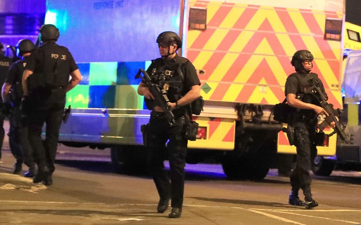 Armed police at Manchester Arena after reports of an explosion at the venue during an Ariana Grande gig.