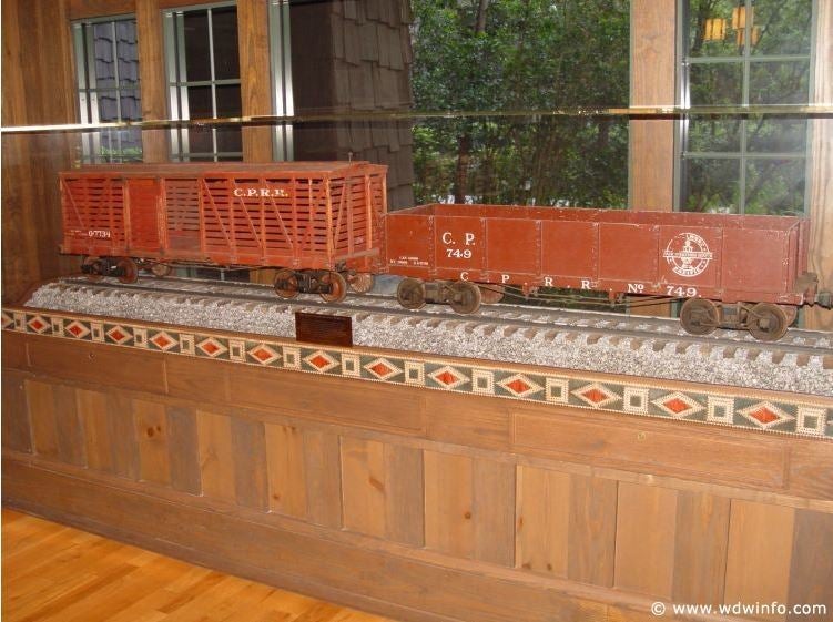 Two train cars from Walt Disney’s Backyard Railroad