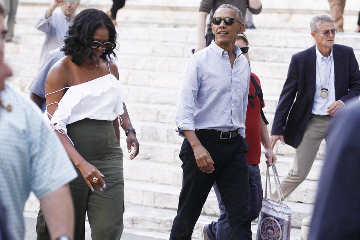 Former U.S. President Barack Obama and Michelle Obama take a walk during their visit to Siena, Tuscany, Italy, on May 22. 