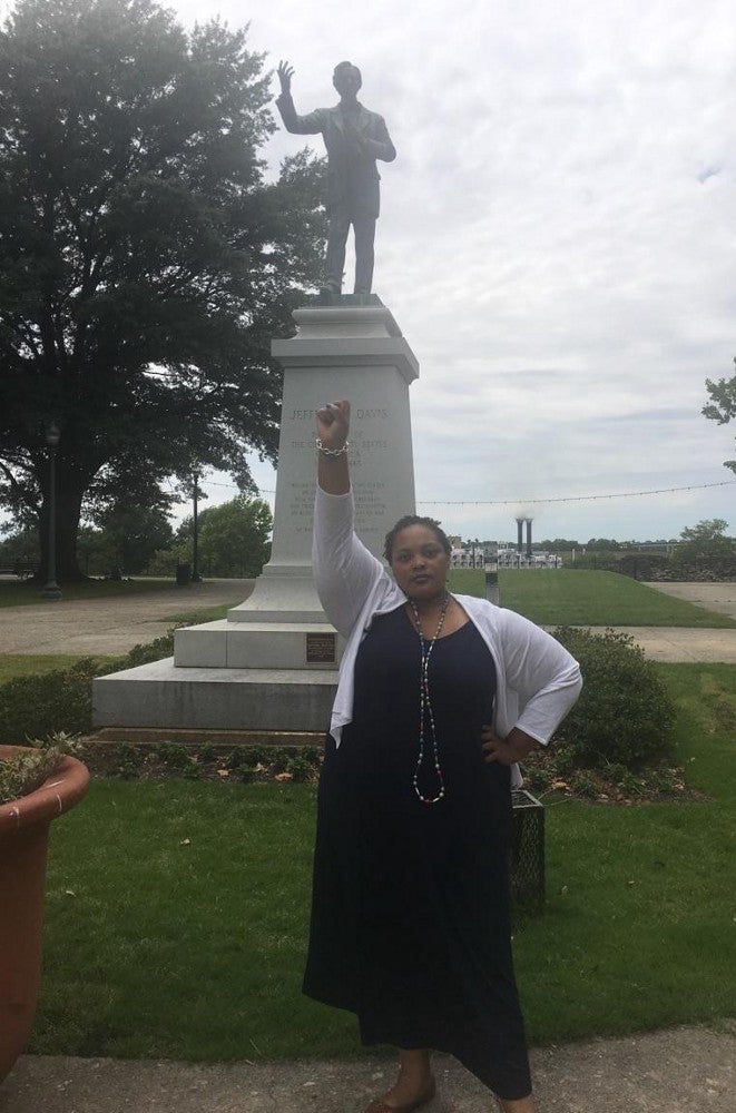 Sawyer stands before the Jefferson Davis Memorial in Downtown Memphis