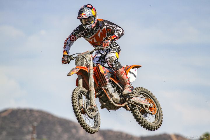 From 2012 through 2017, Ryan Dungey would capture five national titles aboard his Red Bull KTM 450SX-F, becoming one of the most successful riders of all time. Here, Ryan flies through the hot and humid skies of the notorious Lake Elsinore National in Southern California in 2013. 