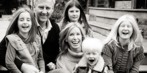 Victoria and her family before the accident. Left to right: Emily, Nicko, Olivia, Victoria with Kit on her lap and Amber.