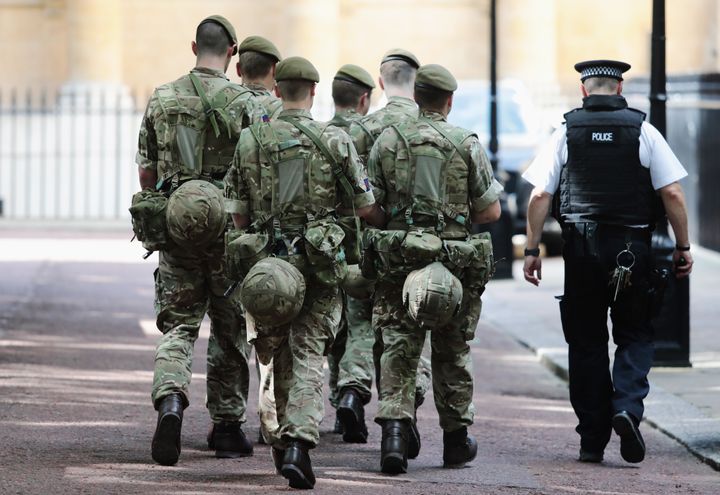 Soldiers arrive near Buckingham Palace on Wednesday
