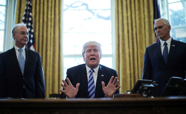 President Donald Trump (center) sits with Secretary of Health and Human Services Tom Price (left) and Vice President Mike Pence (right.)