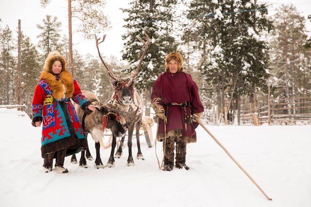 Reindeer herders are seen near Numto Lake in western Siberia. Russia’s recent decision to redraw park boundaries to allow oil development in the area has prompted protests from Indigenous people.