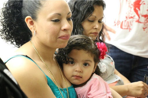 Liliana Cruz Mendez, an undocumented woman from El Salvador, with her daughter.